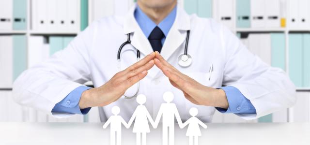physician protecting paper cutout family